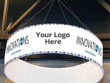 Circular overhanging sign noting where logo would be displayed